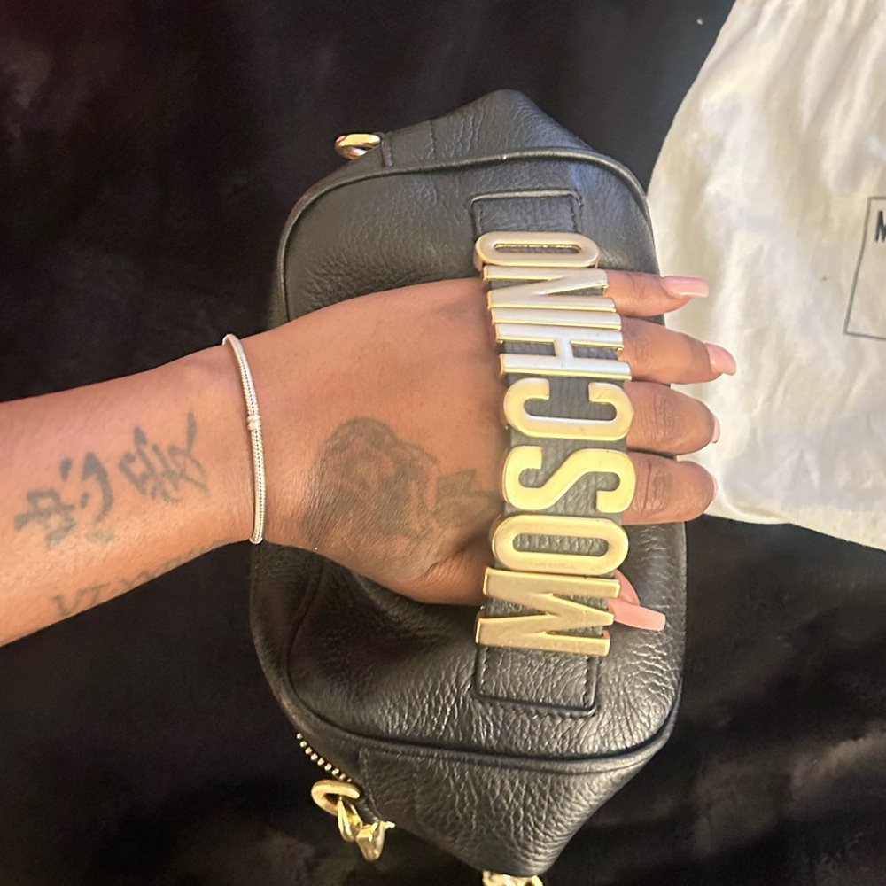 Black moschino bag.
